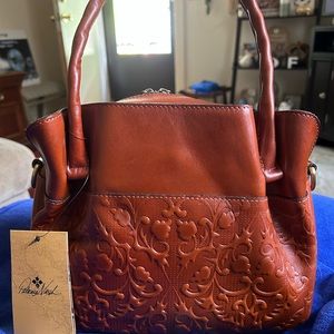 Patricia Nash. Double outside pockets and inside too.